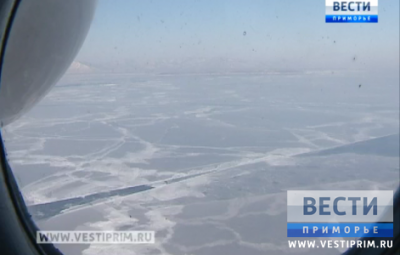 Primorsky region rescuers using helicopter MI-8 to observe the ice area and fishermen