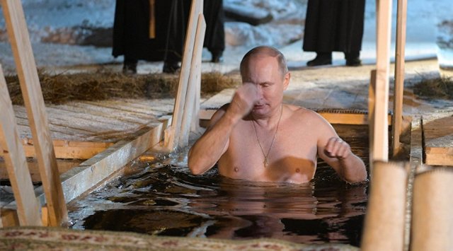 Vladimir Putin takes dip in icy Russian lake for the Epiphany