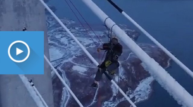 Climbers cut 890 tons of ice from Russky bridge